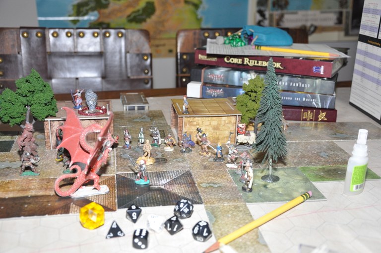 tabletop scene with miniatures and dice